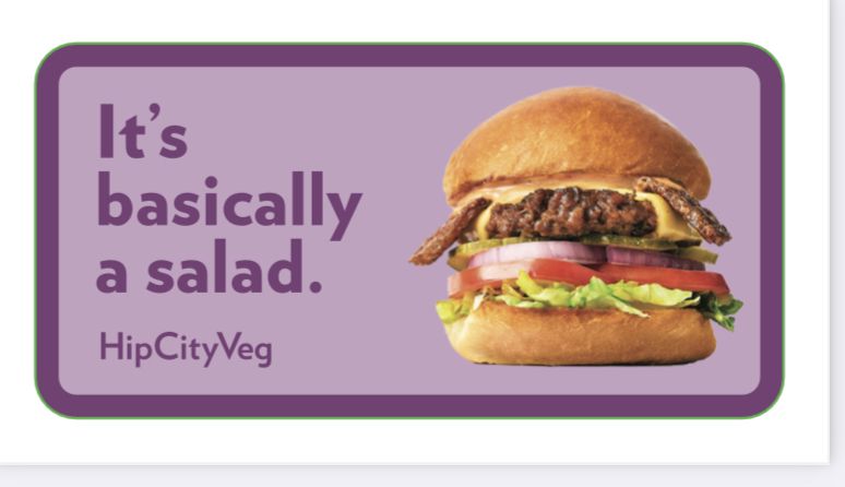 A HipCityVeg branded sticker reading “It’s basically a salad.” beside a photograph of a HipCityVeg burger.