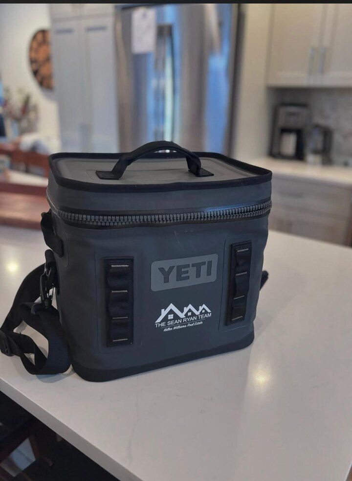 A branded YETI soft cooler carrying The Sean Ryan Team Keller Williams Real Estate logo, used as the campaign prize.